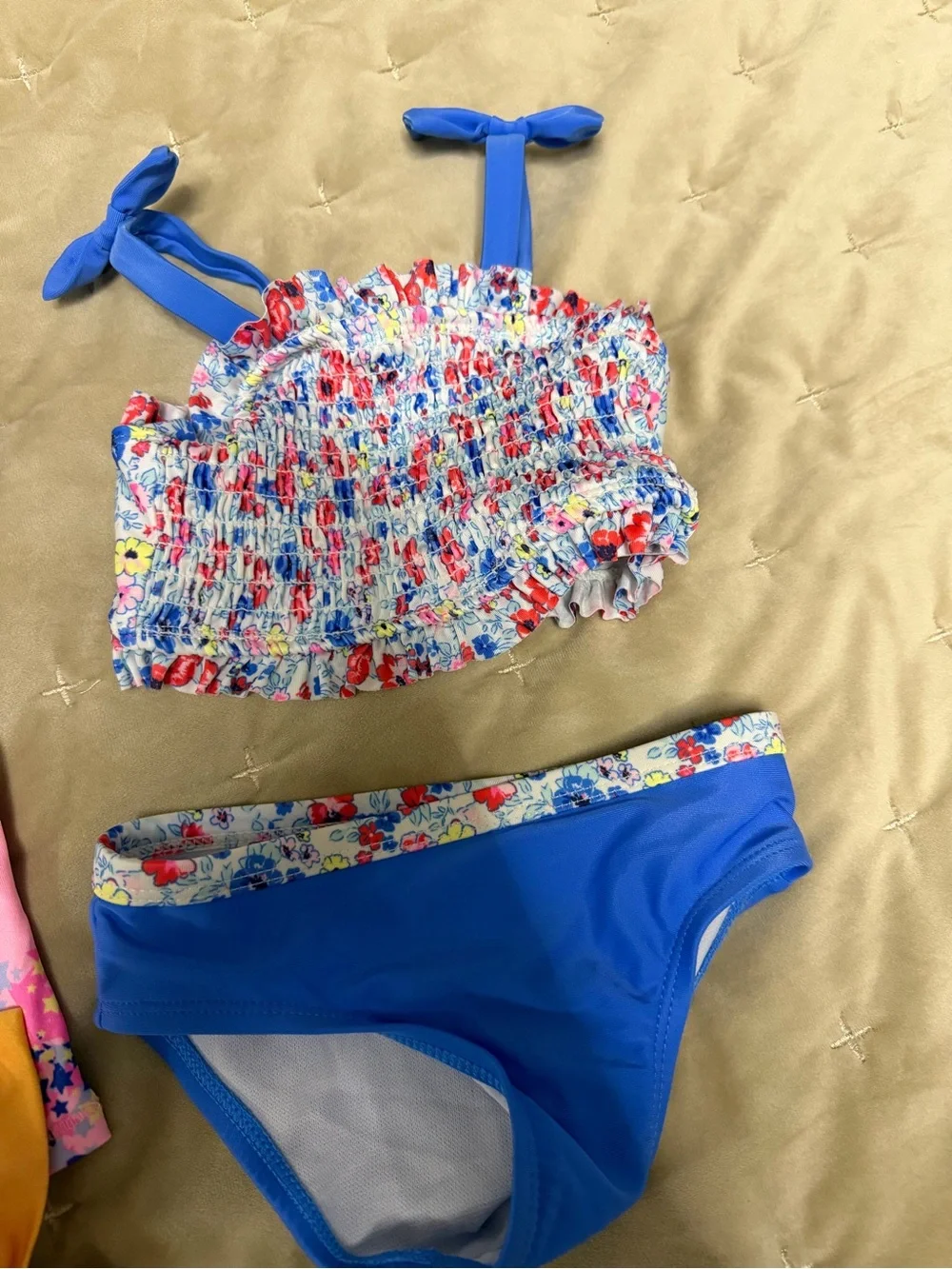 Champion Kids Swim Shirt with two bikinis featuring unicorns and flowers